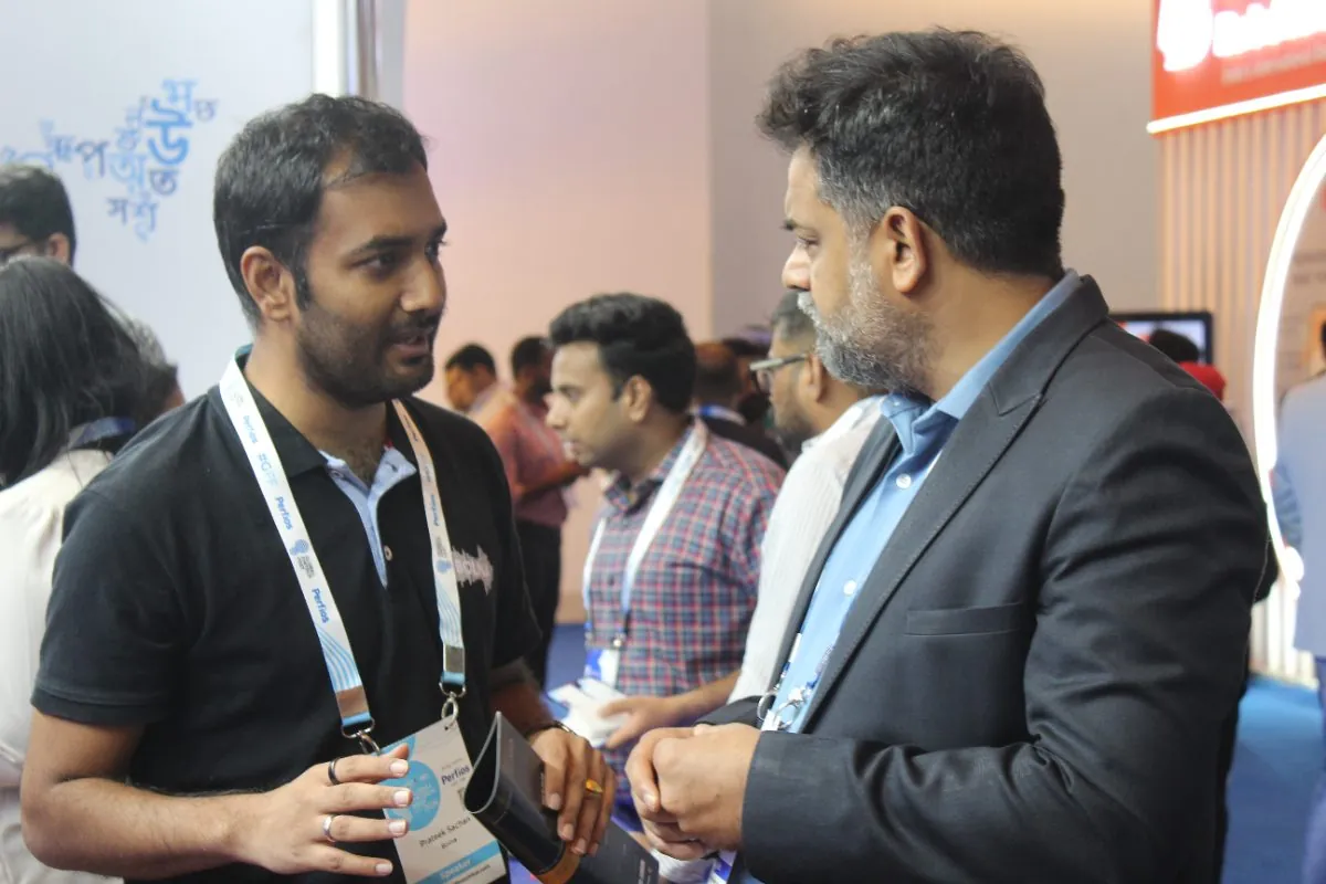 Attendees talking on the expo floor
